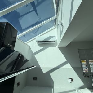 Professional air conditioning installation in a contemporary UK home interior